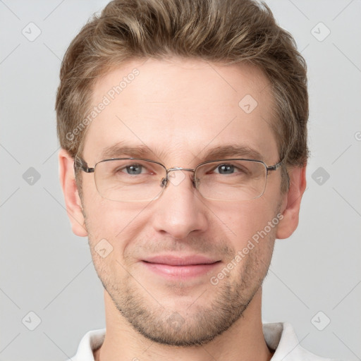 Joyful white adult male with short  brown hair and grey eyes