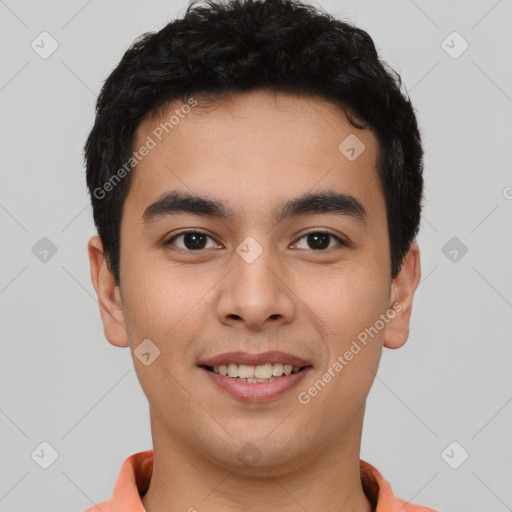 Joyful latino young-adult male with short  brown hair and brown eyes