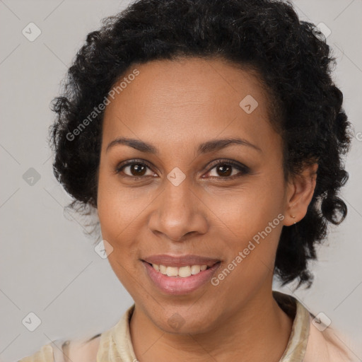 Joyful black adult female with short  brown hair and brown eyes