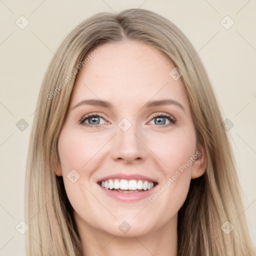 Joyful white young-adult female with long  brown hair and blue eyes