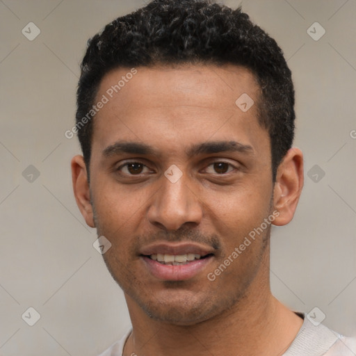 Joyful latino young-adult male with short  black hair and brown eyes