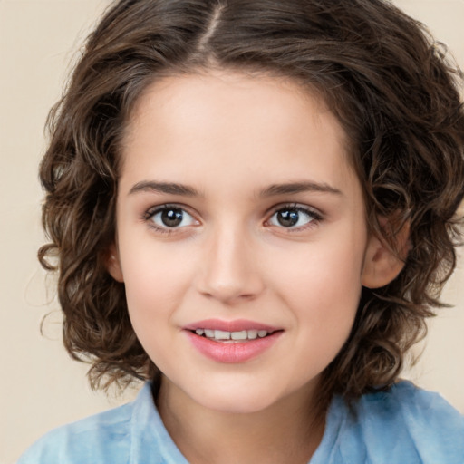 Joyful white child female with medium  brown hair and brown eyes