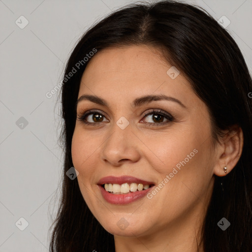 Joyful white young-adult female with long  brown hair and brown eyes