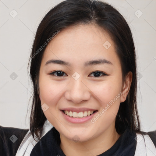 Joyful white young-adult female with medium  brown hair and brown eyes