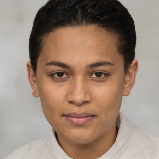 Joyful latino young-adult female with short  brown hair and brown eyes