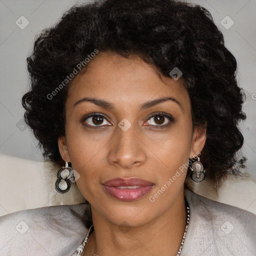 Joyful black young-adult female with long  brown hair and brown eyes