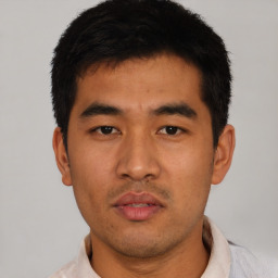 Neutral asian young-adult male with short  black hair and brown eyes