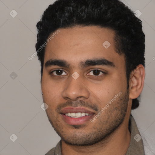 Joyful latino young-adult male with short  black hair and brown eyes