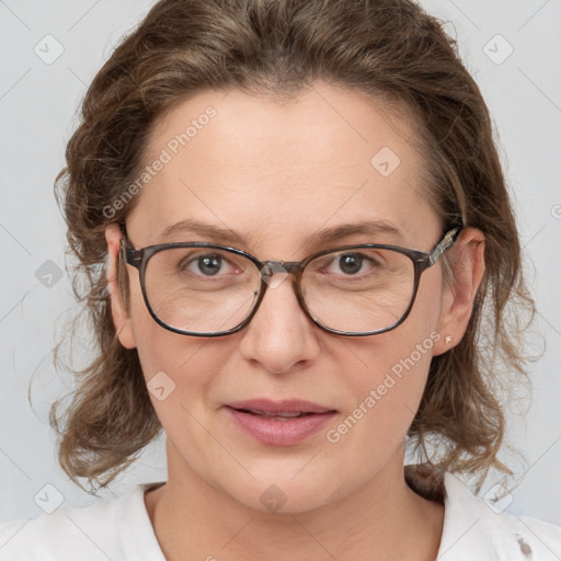 Joyful white adult female with medium  brown hair and blue eyes