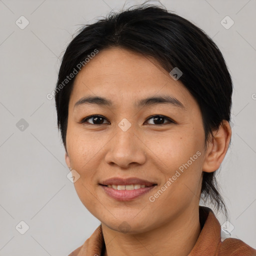 Joyful asian young-adult female with medium  brown hair and brown eyes