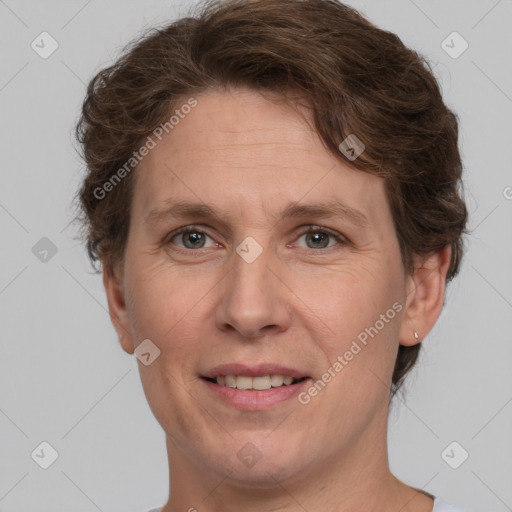 Joyful white adult female with short  brown hair and brown eyes