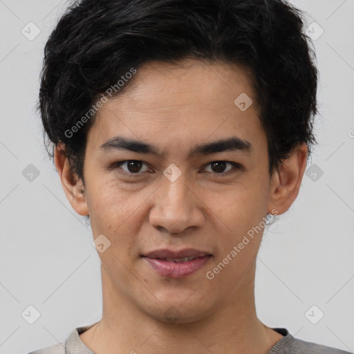 Joyful latino young-adult male with short  brown hair and brown eyes