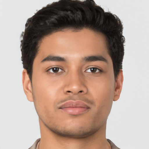 Neutral latino young-adult male with short  brown hair and brown eyes