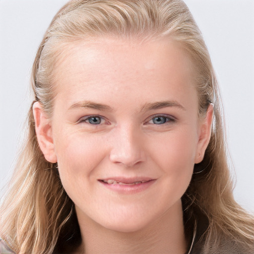 Joyful white young-adult female with long  brown hair and blue eyes