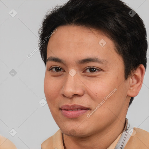 Joyful white adult male with short  brown hair and brown eyes