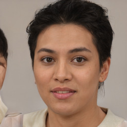 Joyful asian young-adult female with medium  brown hair and brown eyes