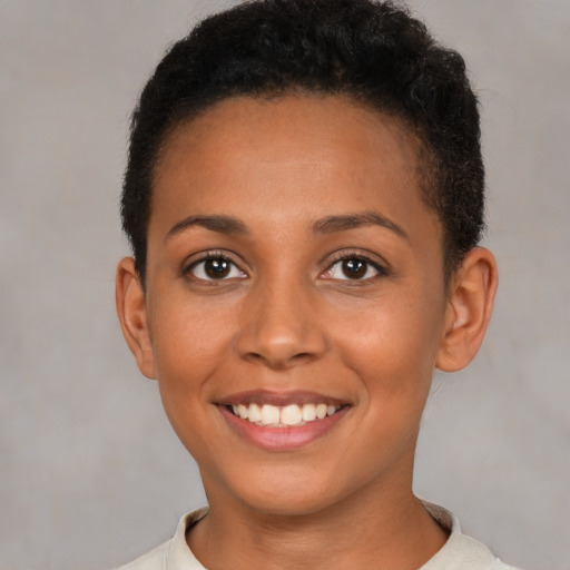 Joyful latino young-adult female with short  brown hair and brown eyes