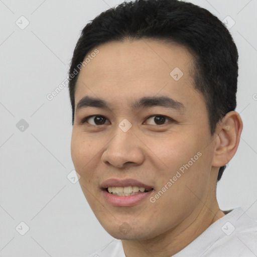 Joyful latino young-adult male with short  black hair and brown eyes