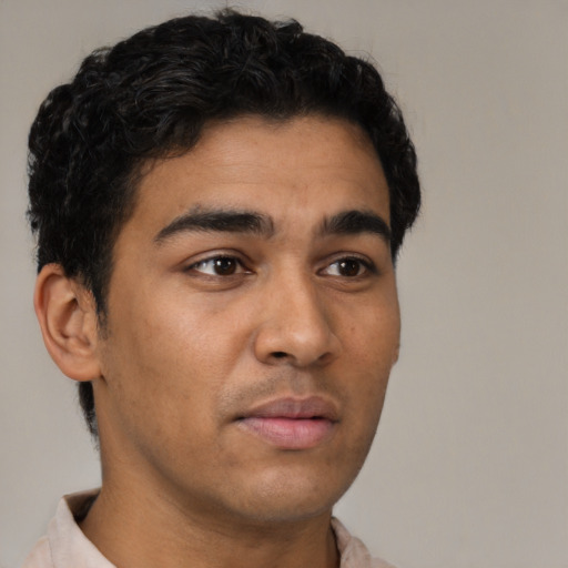 Neutral latino young-adult male with short  brown hair and brown eyes