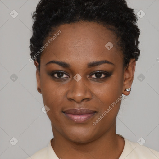 Joyful black young-adult female with short  black hair and brown eyes