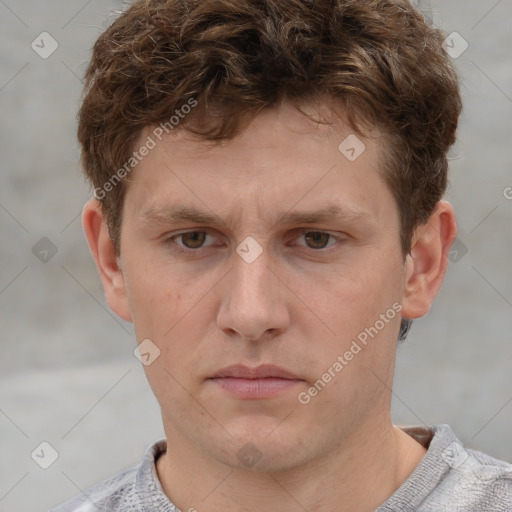 Neutral white young-adult male with short  brown hair and grey eyes