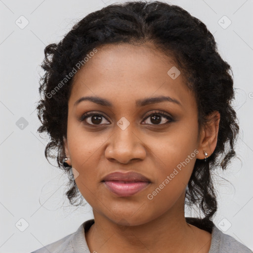 Joyful black young-adult female with medium  black hair and brown eyes