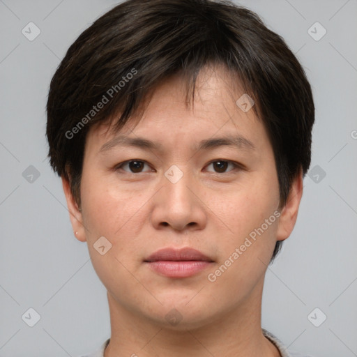 Joyful asian young-adult female with short  brown hair and brown eyes