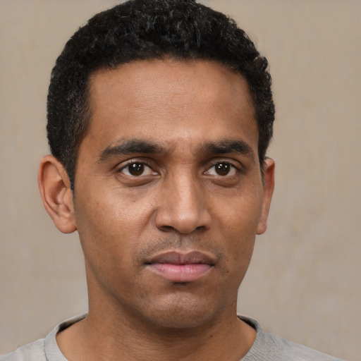 Neutral black young-adult male with short  black hair and brown eyes