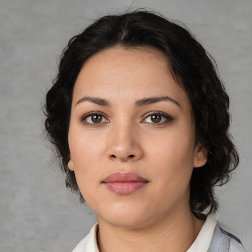 Neutral latino young-adult female with medium  brown hair and brown eyes
