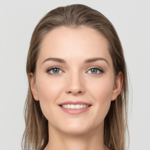 Joyful white young-adult female with long  brown hair and grey eyes