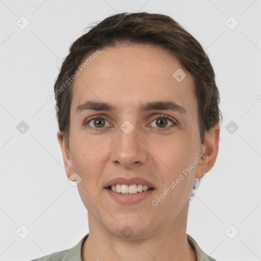 Joyful white young-adult female with short  brown hair and grey eyes