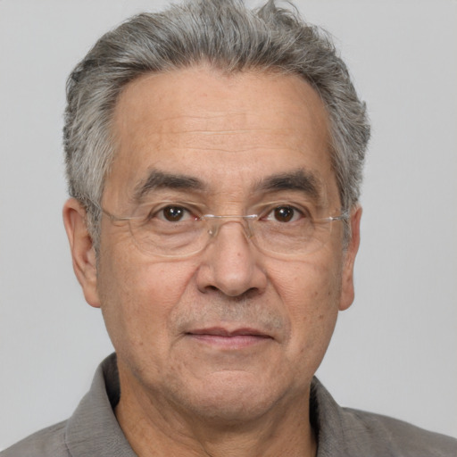 Neutral white middle-aged male with short  gray hair and brown eyes