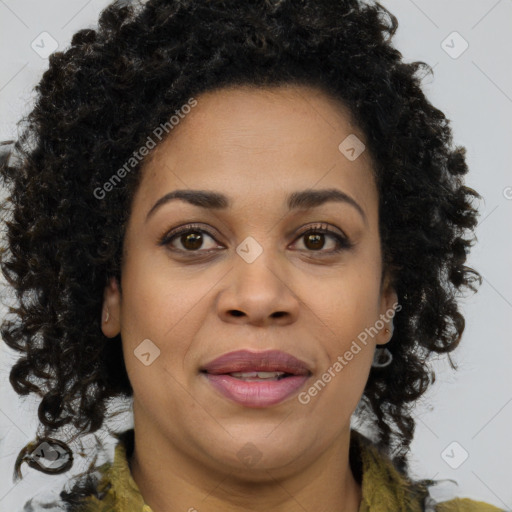 Joyful black adult female with medium  brown hair and brown eyes