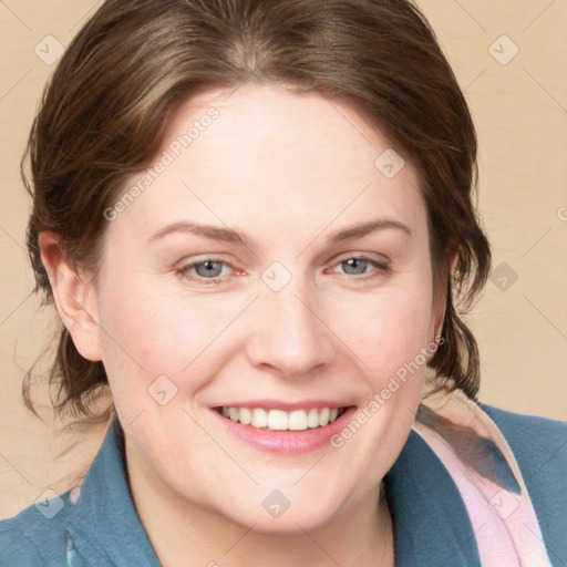 Joyful white young-adult female with medium  brown hair and blue eyes