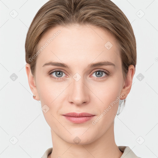 Joyful white young-adult female with short  brown hair and grey eyes