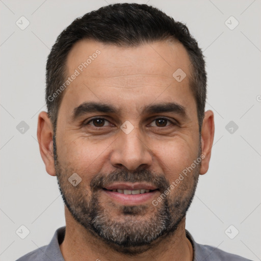 Joyful white adult male with short  black hair and brown eyes