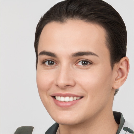 Joyful white young-adult female with short  brown hair and brown eyes