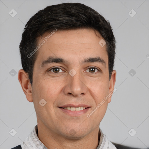 Joyful white adult male with short  black hair and brown eyes