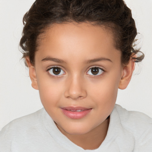 Joyful white child female with short  brown hair and brown eyes