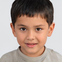 Joyful white child male with short  brown hair and brown eyes