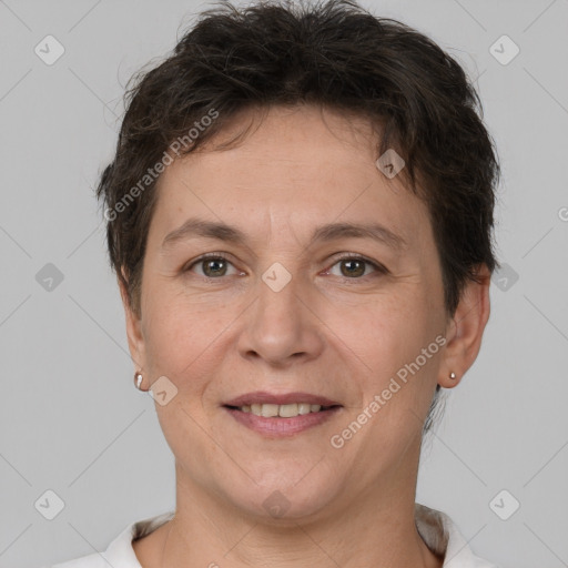 Joyful white adult female with short  brown hair and brown eyes