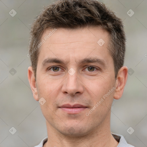 Joyful white adult male with short  brown hair and brown eyes