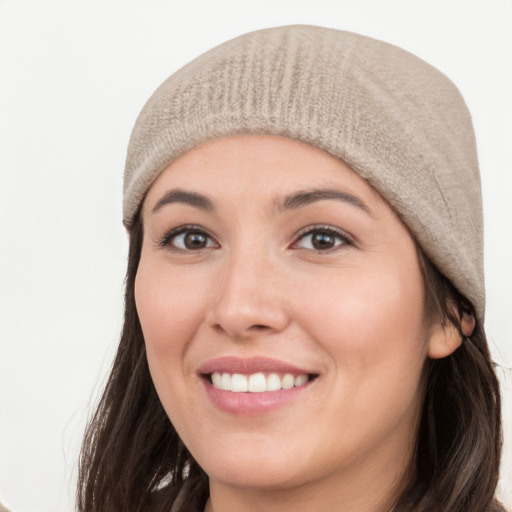 Joyful white young-adult female with long  black hair and brown eyes