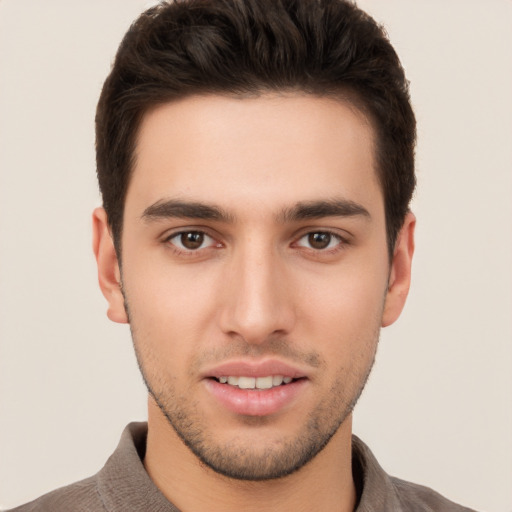 Joyful white young-adult male with short  brown hair and brown eyes