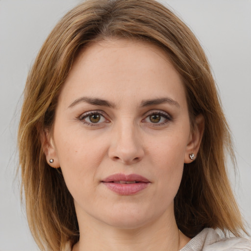 Joyful white young-adult female with medium  brown hair and brown eyes