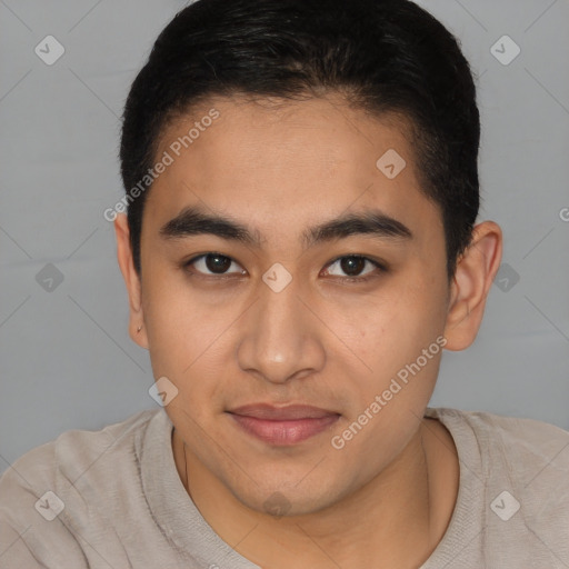 Joyful latino young-adult male with short  brown hair and brown eyes