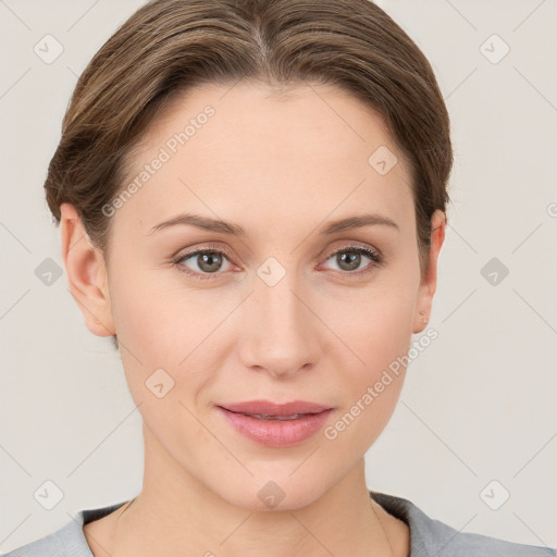 Joyful white young-adult female with short  brown hair and grey eyes