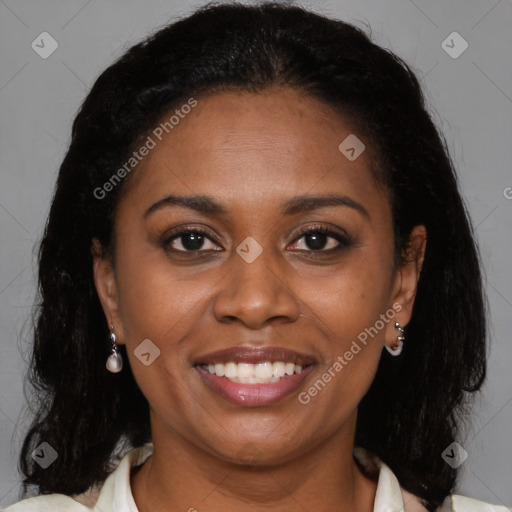 Joyful black young-adult female with medium  brown hair and brown eyes