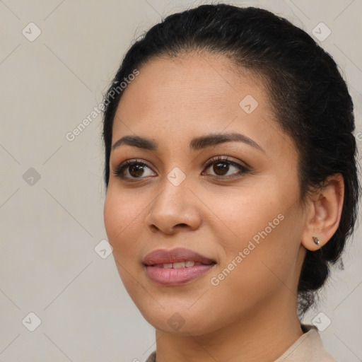 Joyful latino young-adult female with medium  brown hair and brown eyes