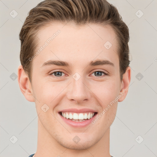 Joyful white young-adult male with short  brown hair and grey eyes